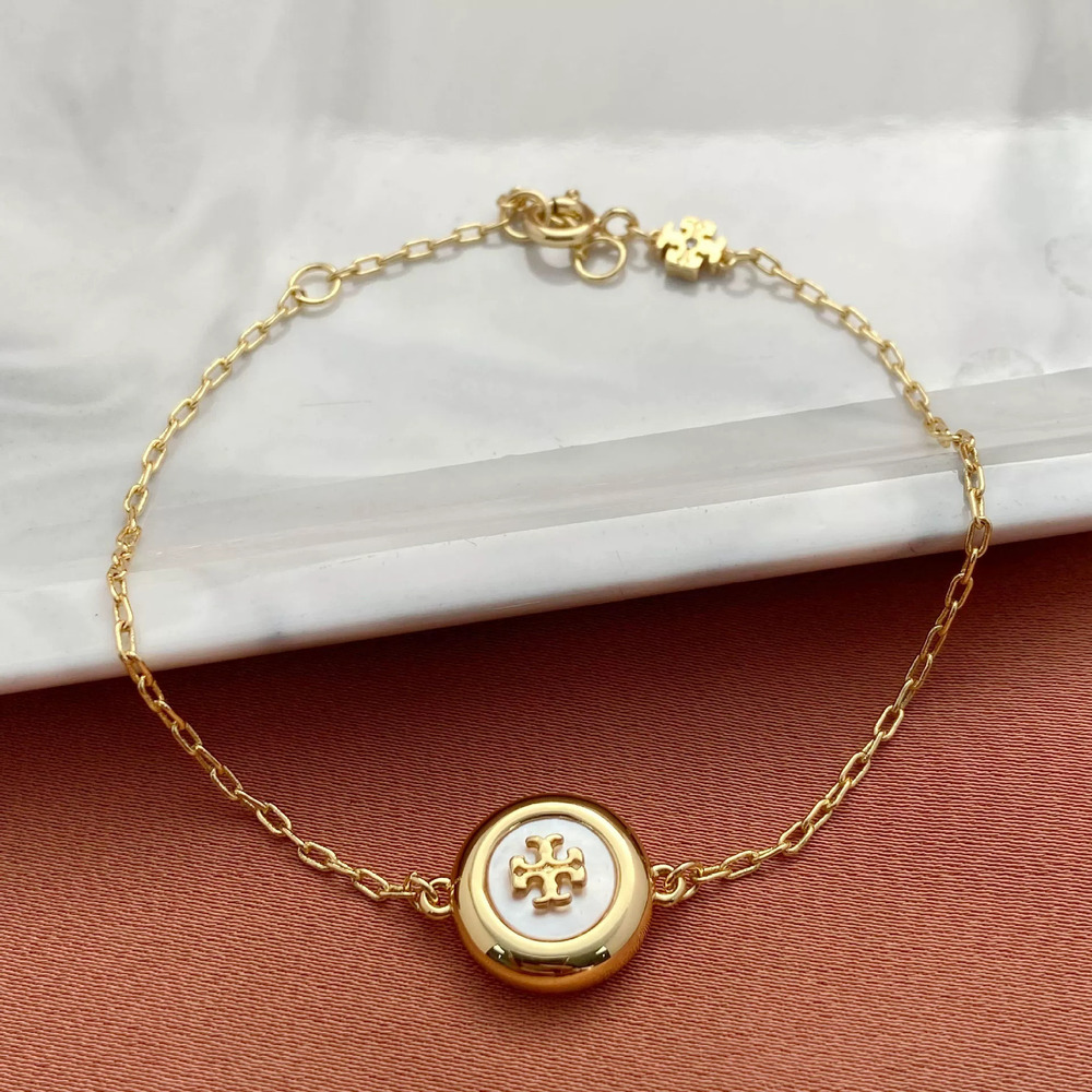 Tory Burch Natural Shell Letter Pendant Metal Bracelet